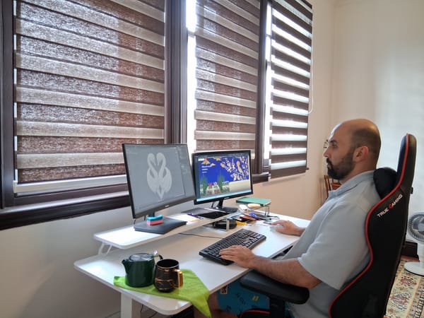 Hamed at his desk, sculpting in Blender