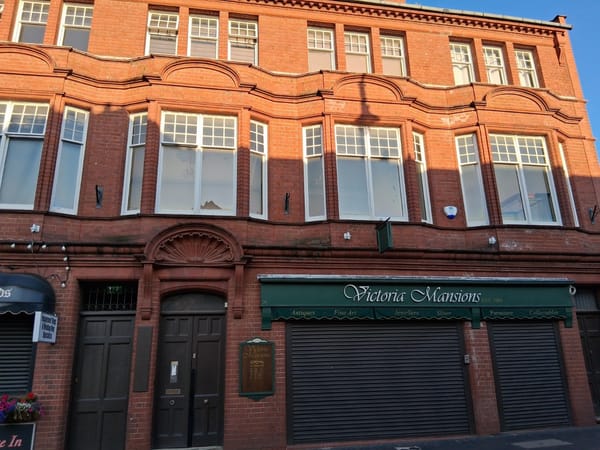 The red brick frontage of Victoria Mansions in Birmingham's Jewellery Quarter, established 1901.